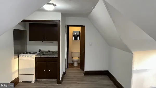 a kitchen with a stove and a refrigerator