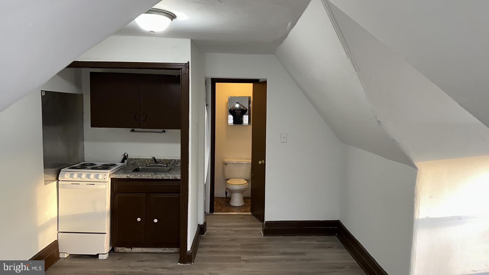 4635 Leiper Street, Unit 5 Philadelphia, PA 19124 - Photo 4 of 9 a kitchen with a stove and a refrigerator