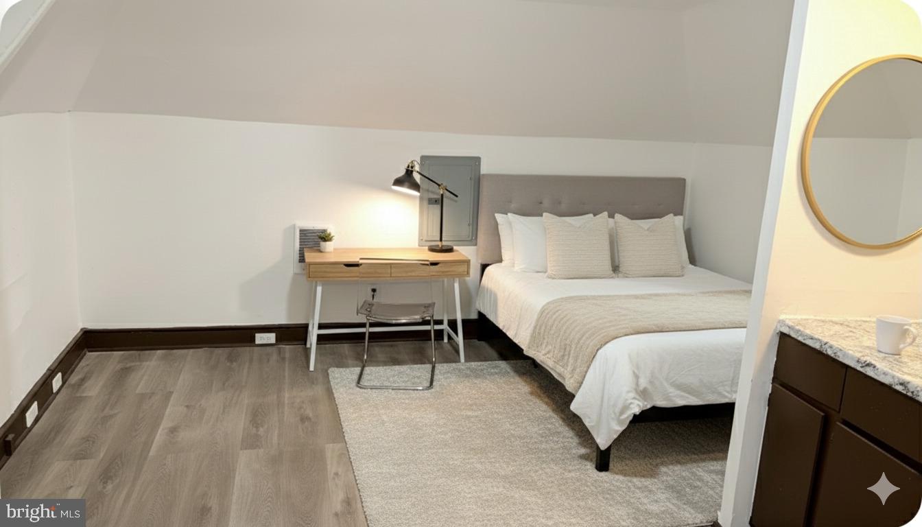 4635 Leiper Street, Unit 5 Philadelphia, PA 19124 - Photo 7 of 9 a bed room with a bed and a chair