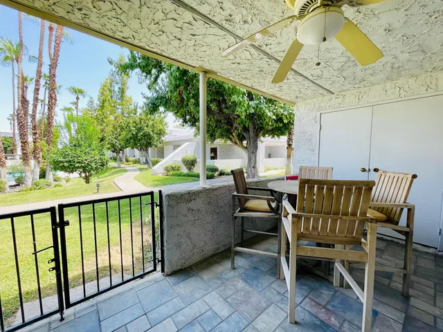 a view of a two chairs in the balcony