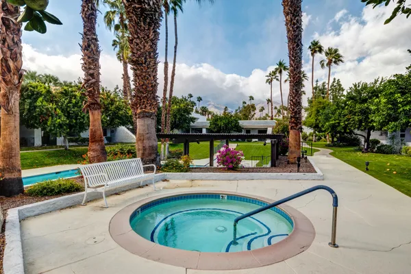 a view of a swimming pool with a outdoor seating