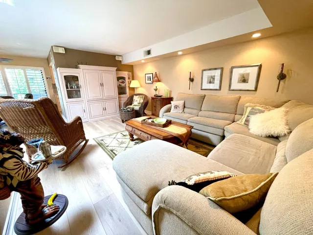 a living room with furniture or couch and a wooden floor