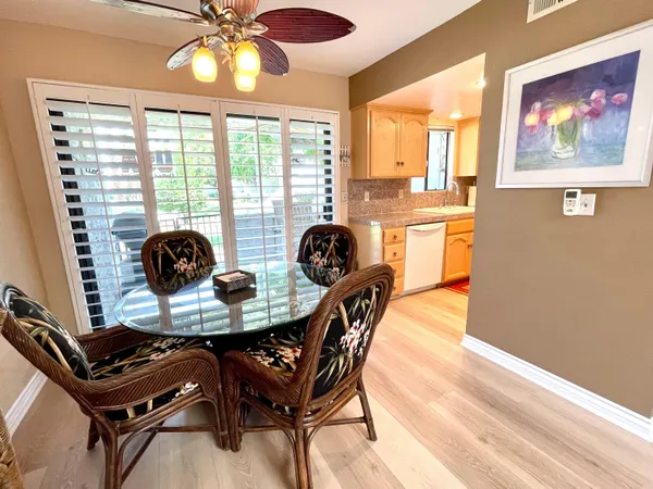 a dining room with furniture and window
