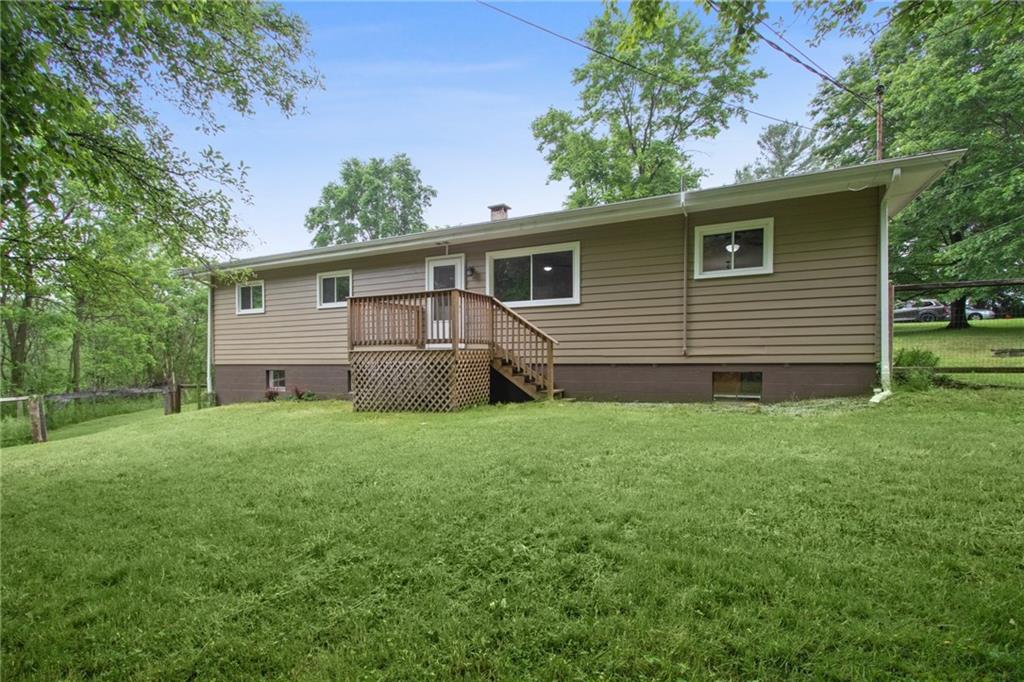 157 Wildwood Road Midland, PA 15059 - Photo 3 of 25 Rear of house with deck off of family room.