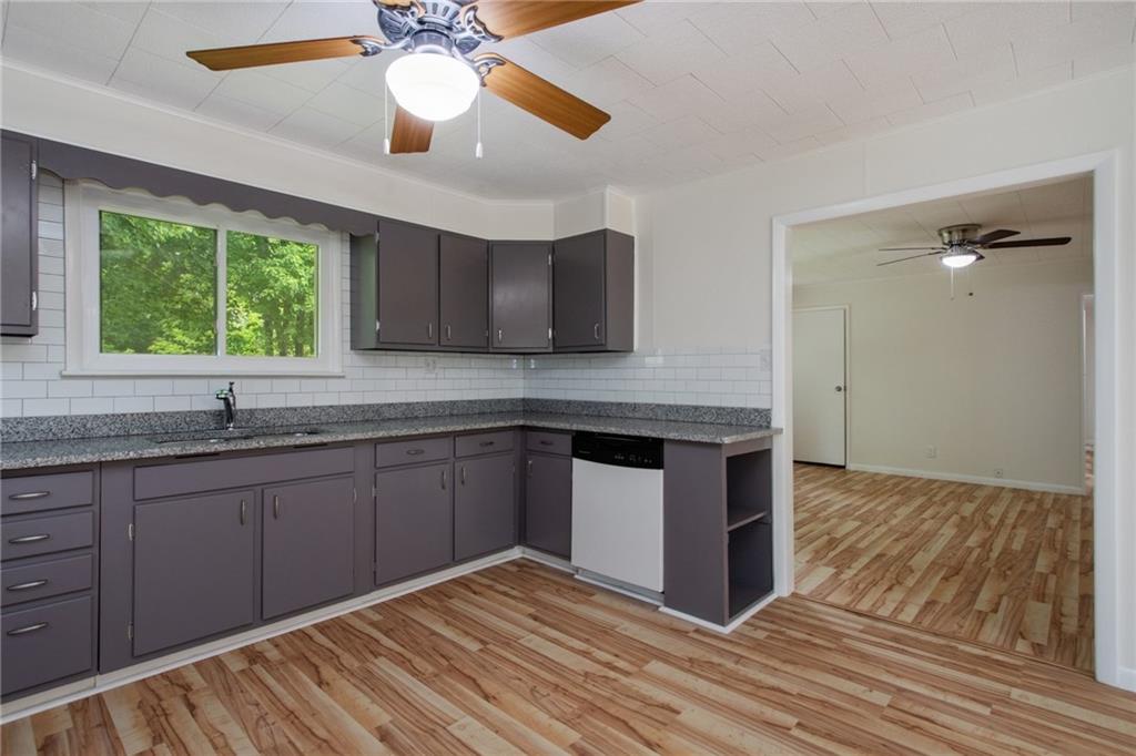 157 Wildwood Road Midland, PA 15059 - Photo 6 of 25 Updated kitchen with access into family room. Newer windows provide bright, natural light!