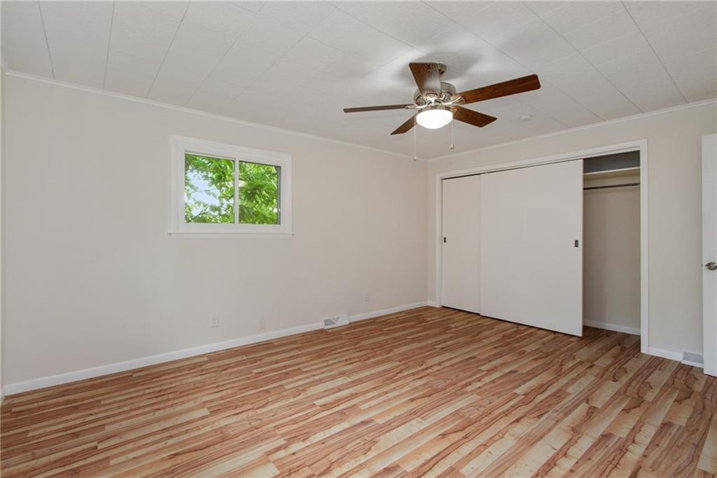 157 Wildwood Road Midland, PA 15059 - Photo 8 of 25 Master bedroom with large closet, ceiling fan, and new flooring!