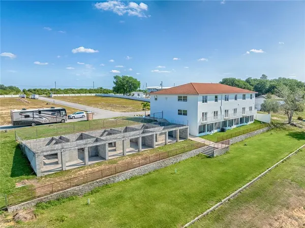 a view of a house with a big yard