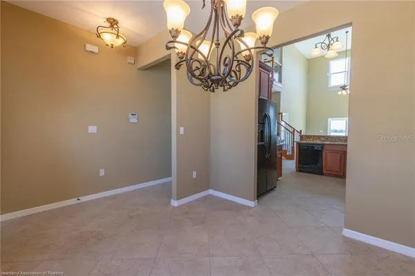 a kitchen with granite countertop a sink stove and cabinets