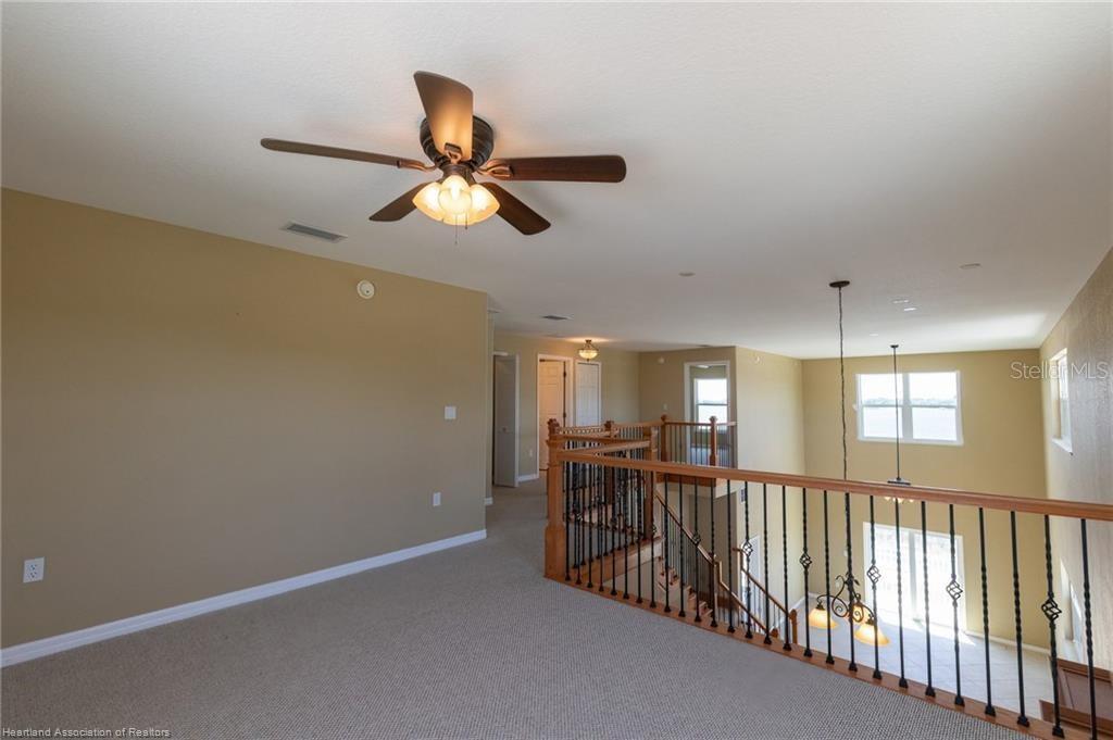 1900 Oasis Boulevard Sebring, FL 33870 - Photo 17 of 18 a view of a hallway with a window