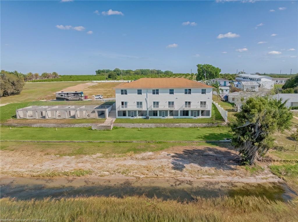 1900 Oasis Boulevard Sebring, FL 33870 - Photo 6 of 18 a view of a house with a big yard