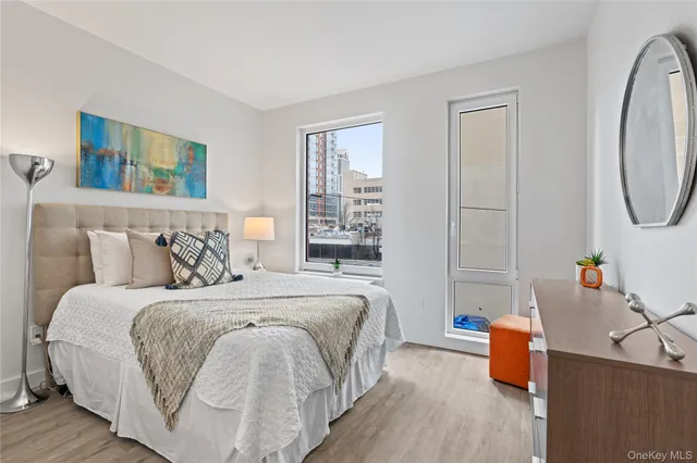 a bedroom with bed and window