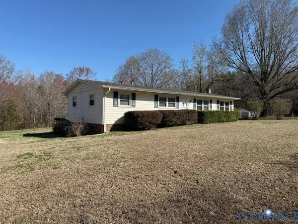 a view of large house with a yard