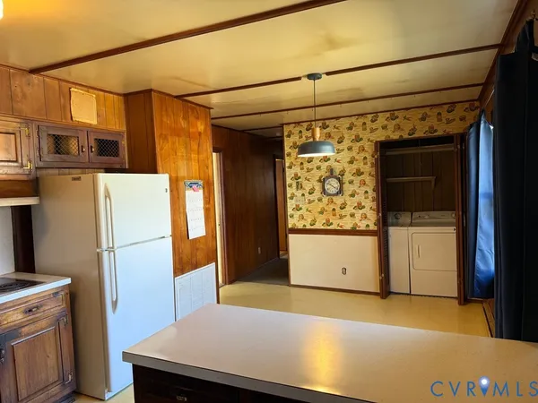 a kitchen with a refrigerator and countertop