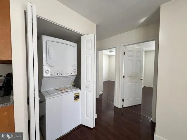 a view of walk in closet with wooden floor