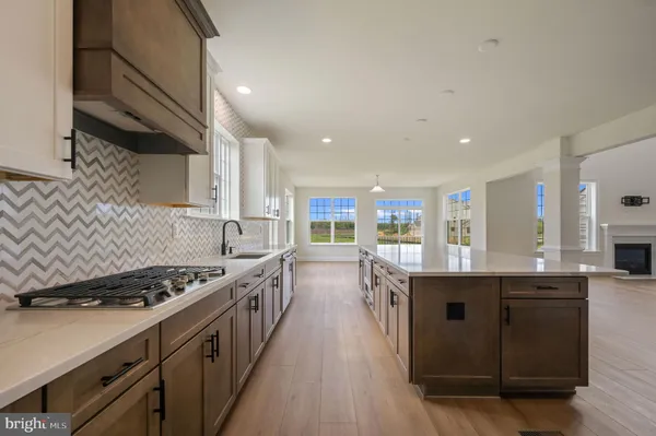a kitchen with stainless steel appliances granite countertop a stove and a sink