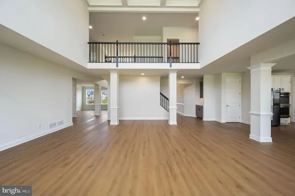 a view of staircase with wooden floor and a rug