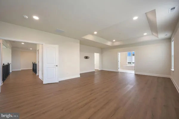 a view of a livingroom with wooden floor