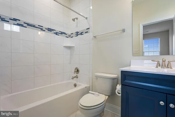 a bathroom with a sink a toilet and a bathtub