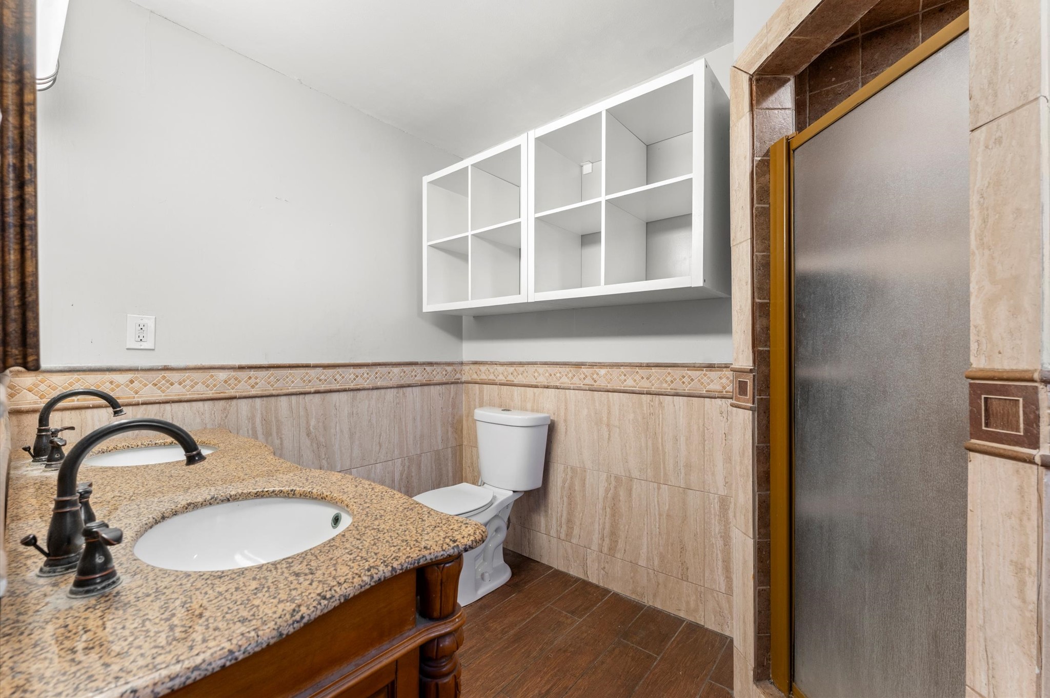 8710 Congo Lane Houston, TX 77040 - Photo 16 of 50 a bathroom with a granite countertop sink a mirror and a shower