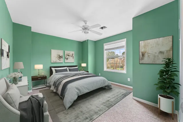 a view of room with window and ceiling fan