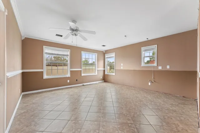 a view of livingroom with furniture and windows