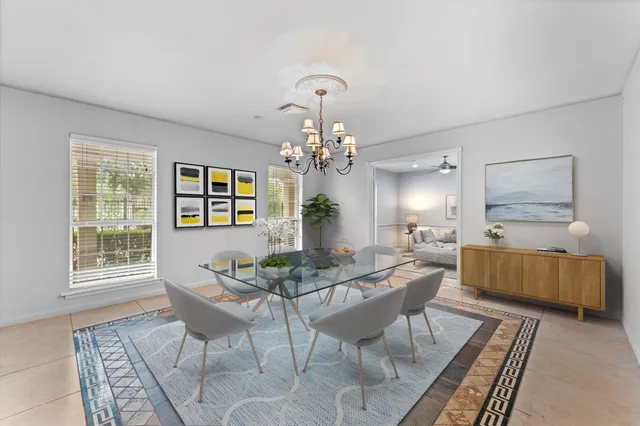 a dining room with furniture and window