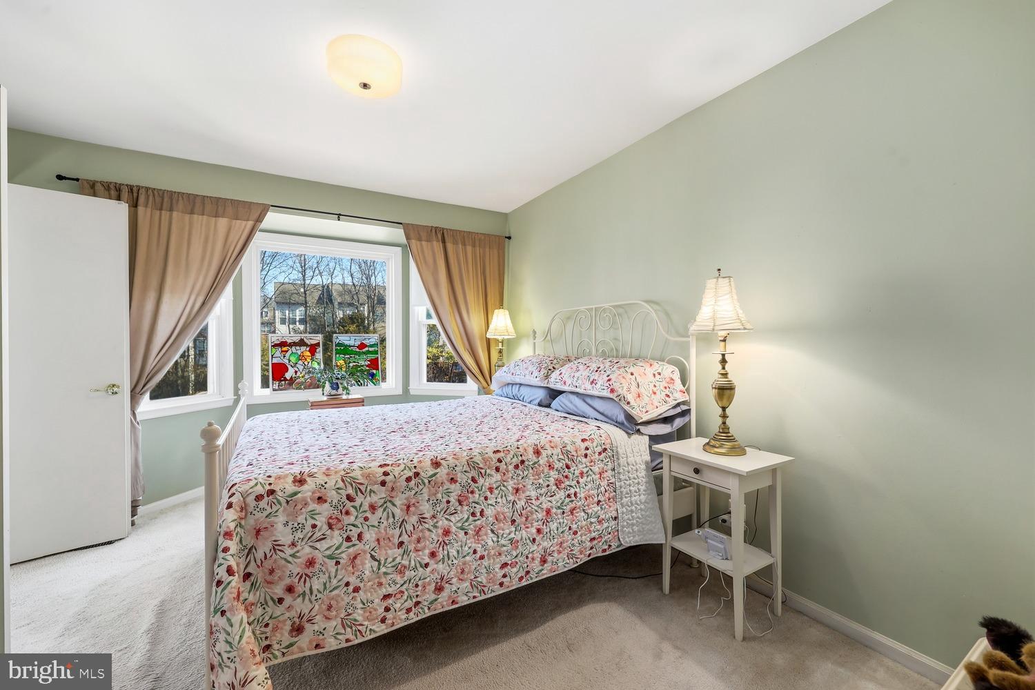 6029 Sunset Ridge Court Centreville, VA 20121 - Photo 11 of 31 a bedroom with a bed and a window