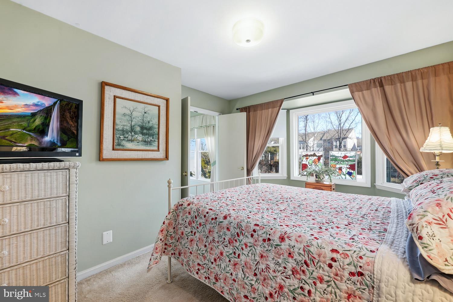 6029 Sunset Ridge Court Centreville, VA 20121 - Photo 12 of 31 a bedroom with a bed and a flat screen tv