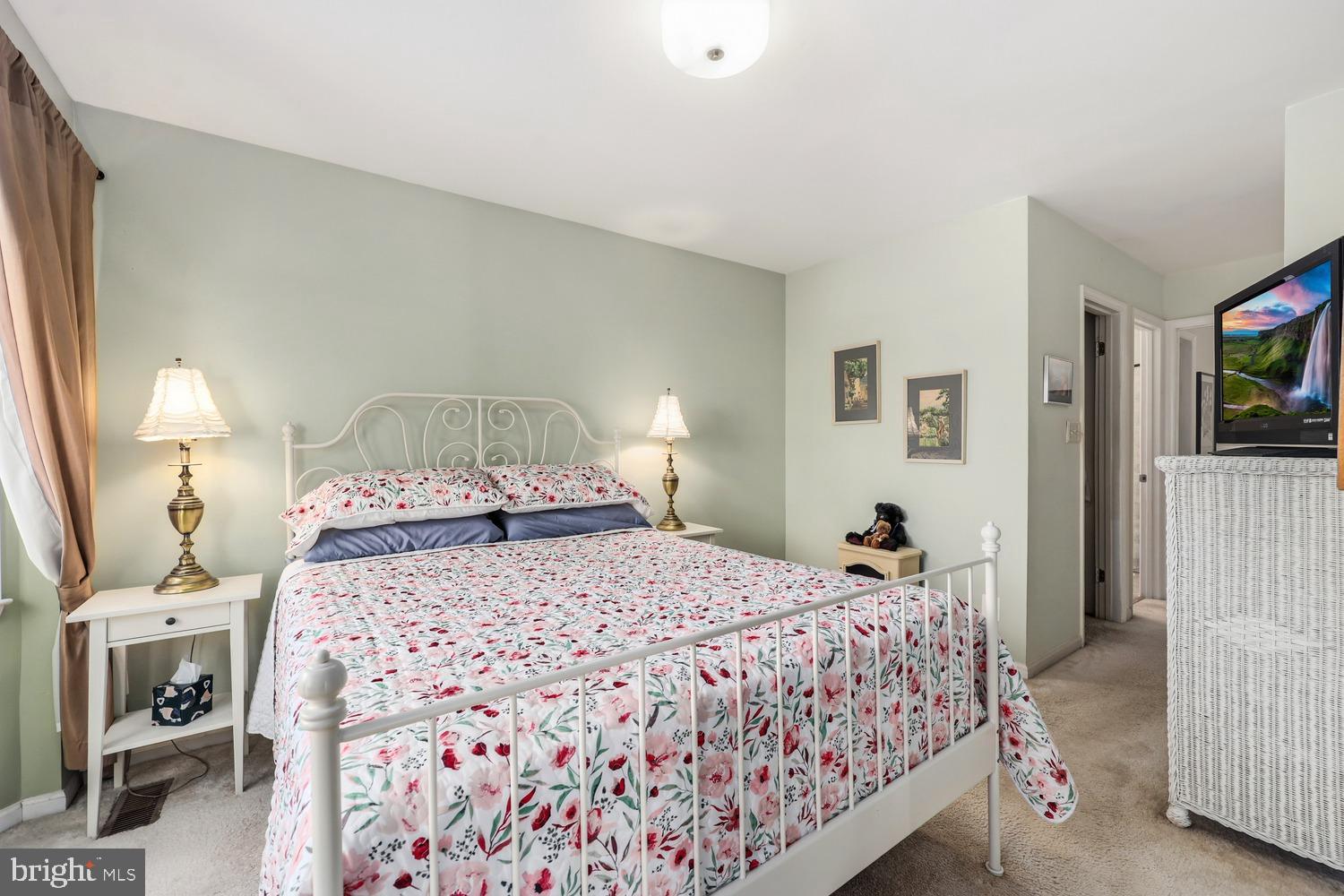 6029 Sunset Ridge Court Centreville, VA 20121 - Photo 15 of 31 a bedroom with a bed and a mirror