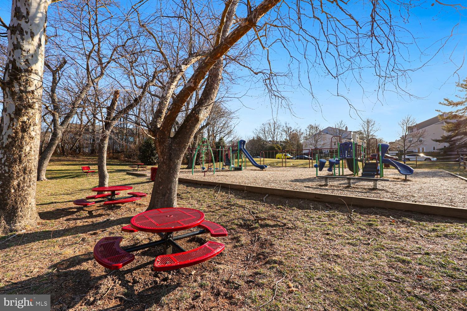 6029 Sunset Ridge Court Centreville, VA 20121 - Photo 26 of 31 a backyard of a house with table and chairs