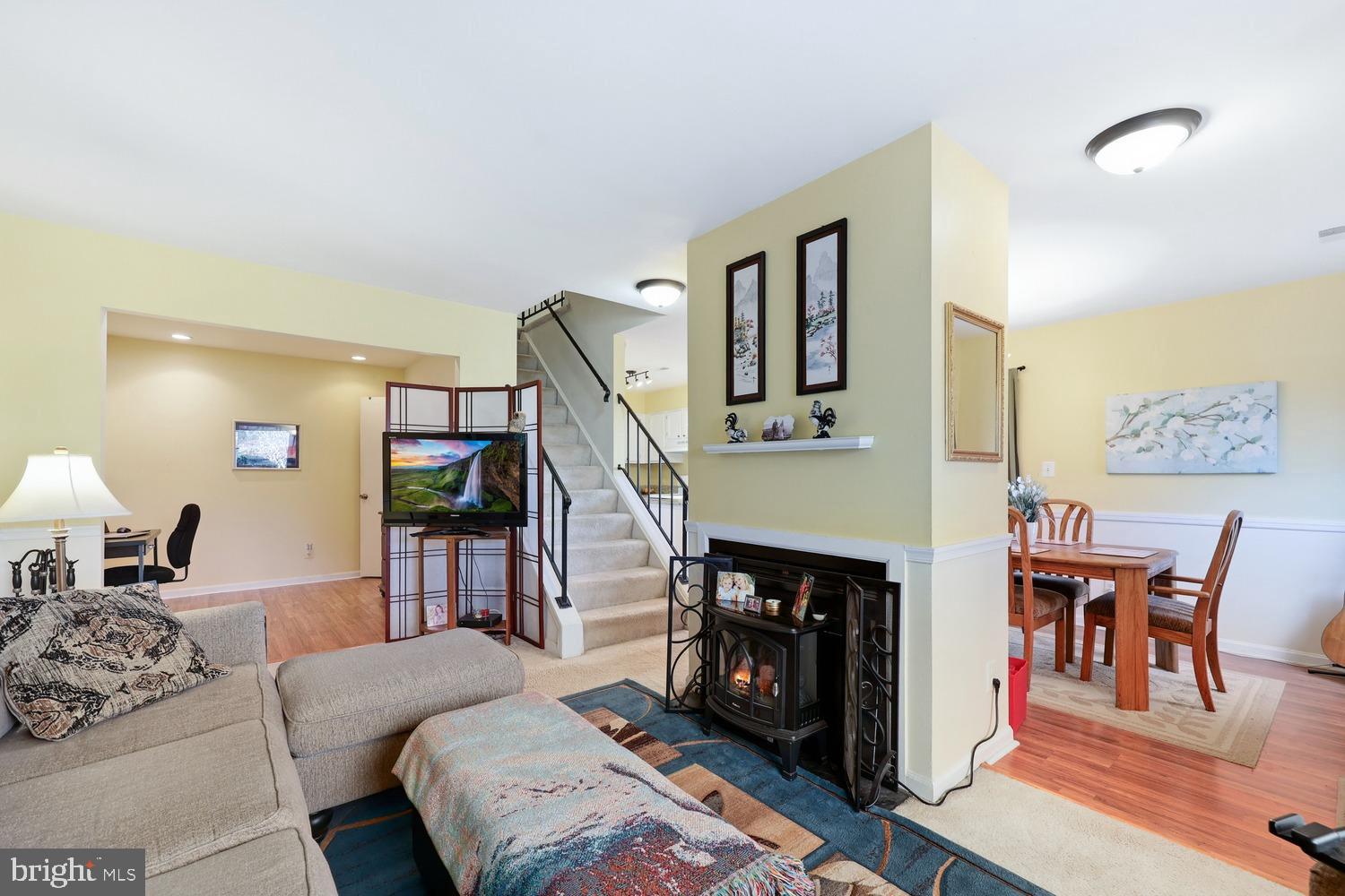 6029 Sunset Ridge Court Centreville, VA 20121 - Photo 4 of 31 a living room with furniture and a fireplace