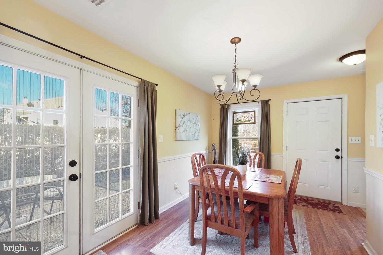 6029 Sunset Ridge Court Centreville, VA 20121 - Photo 8 of 31 a view of a dining room with furniture window and wooden floor