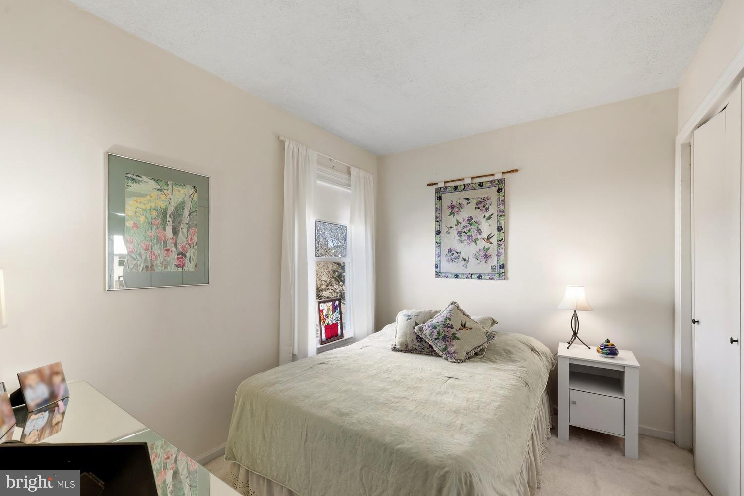 6029 Sunset Ridge Court Centreville, VA 20121 - Photo 10 of 31 a bedroom with a bed and a table