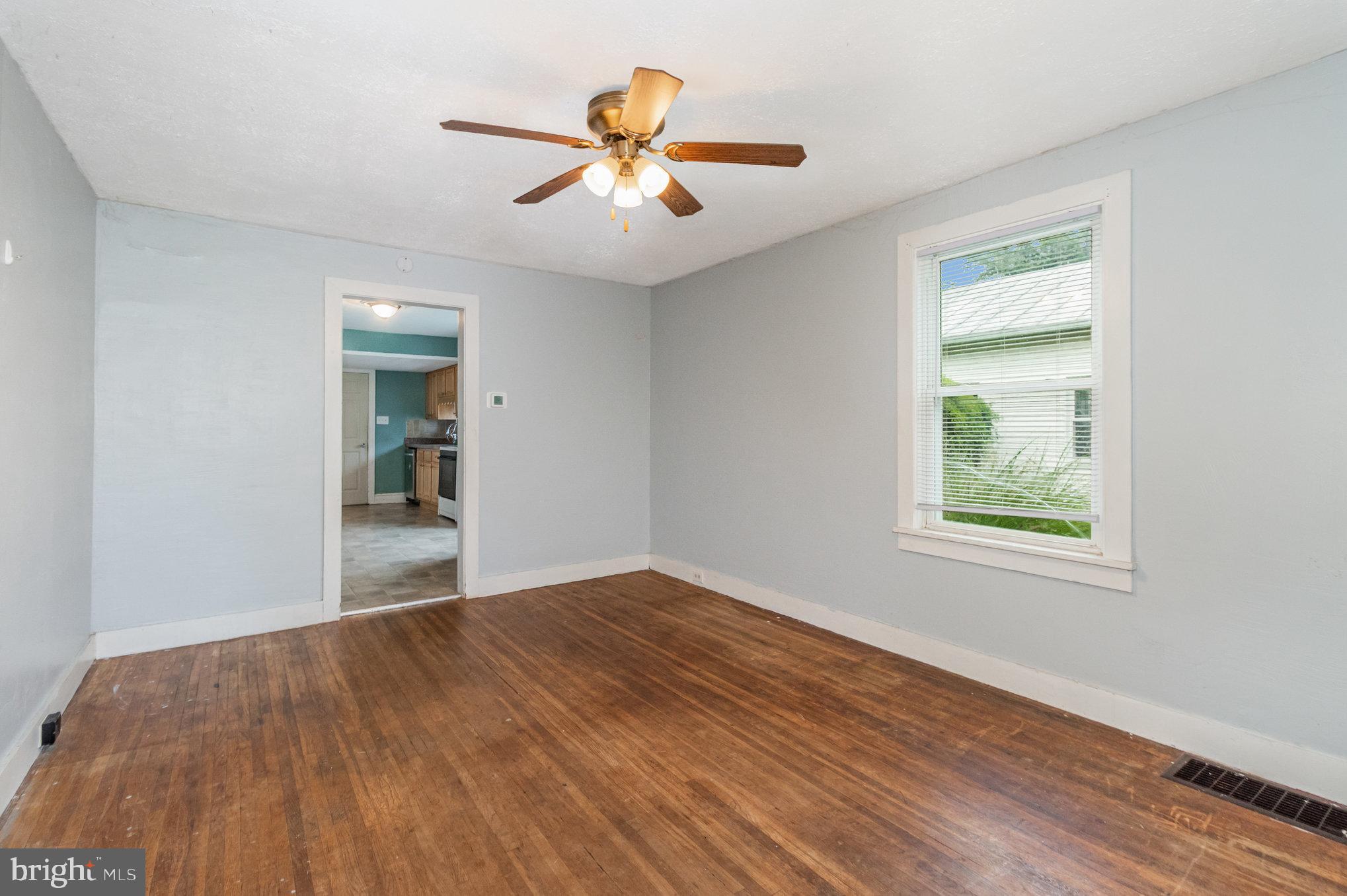 273 Copenhaffer Road York, PA 17404 - Photo 3 of 24 a view of empty room with wooden floor and fan