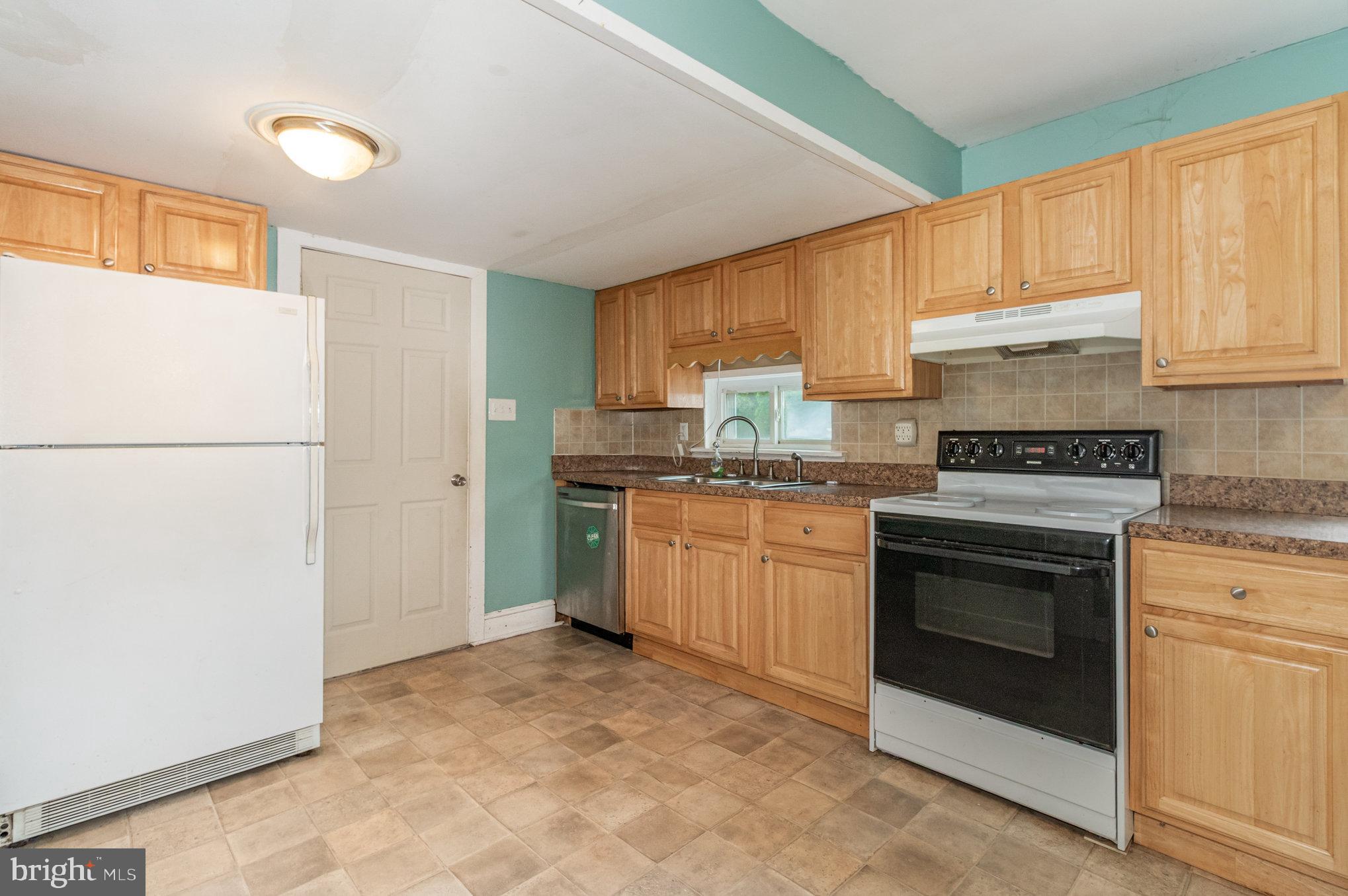 273 Copenhaffer Road York, PA 17404 - Photo 6 of 24 a kitchen with a sink stove and refrigerator