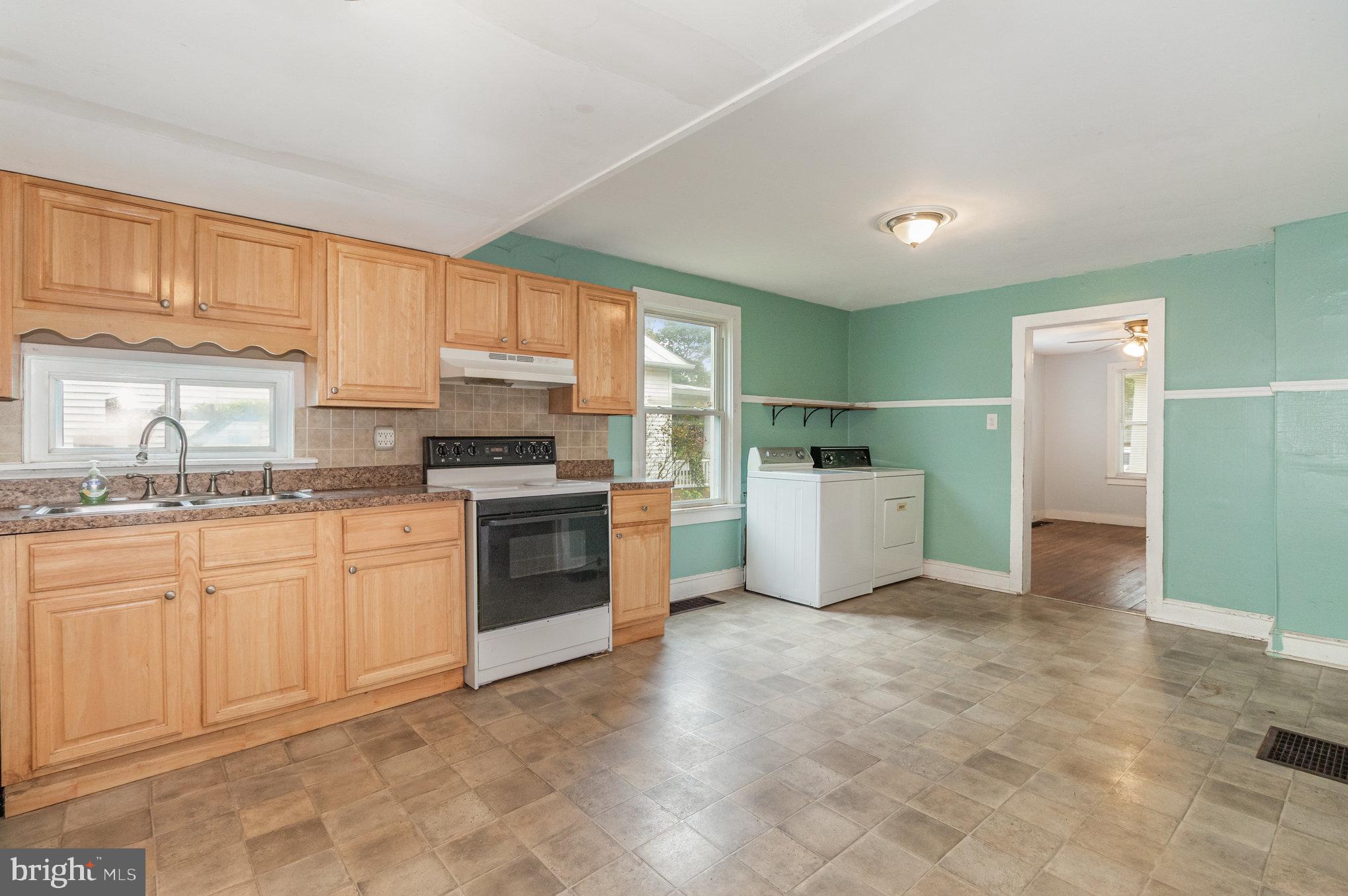 273 Copenhaffer Road York, PA 17404 - Photo 8 of 24 a kitchen with granite countertop a refrigerator sink and cabinets