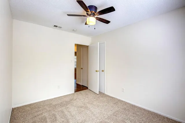 a view of a big room with carpet