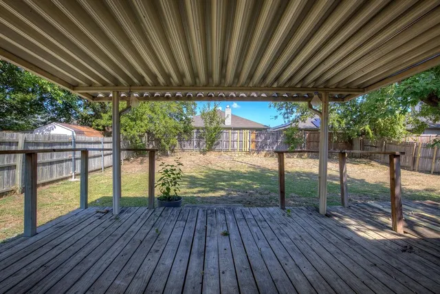 a view of porch with wooden floor