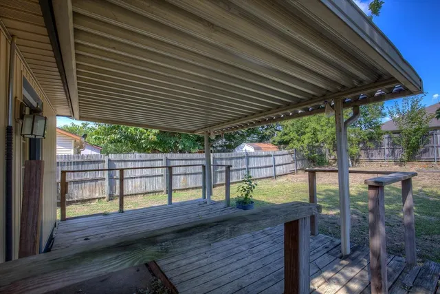 a view of a roof deck with wooden floor