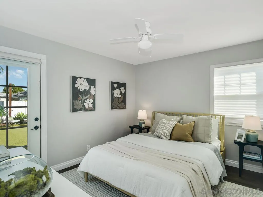 4751 Altadena Avenue San Diego, CA 92115 - Photo 23 of 47 a bedroom with a bed and a painting on the wall