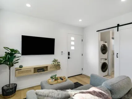 a living room with furniture and a flat screen tv