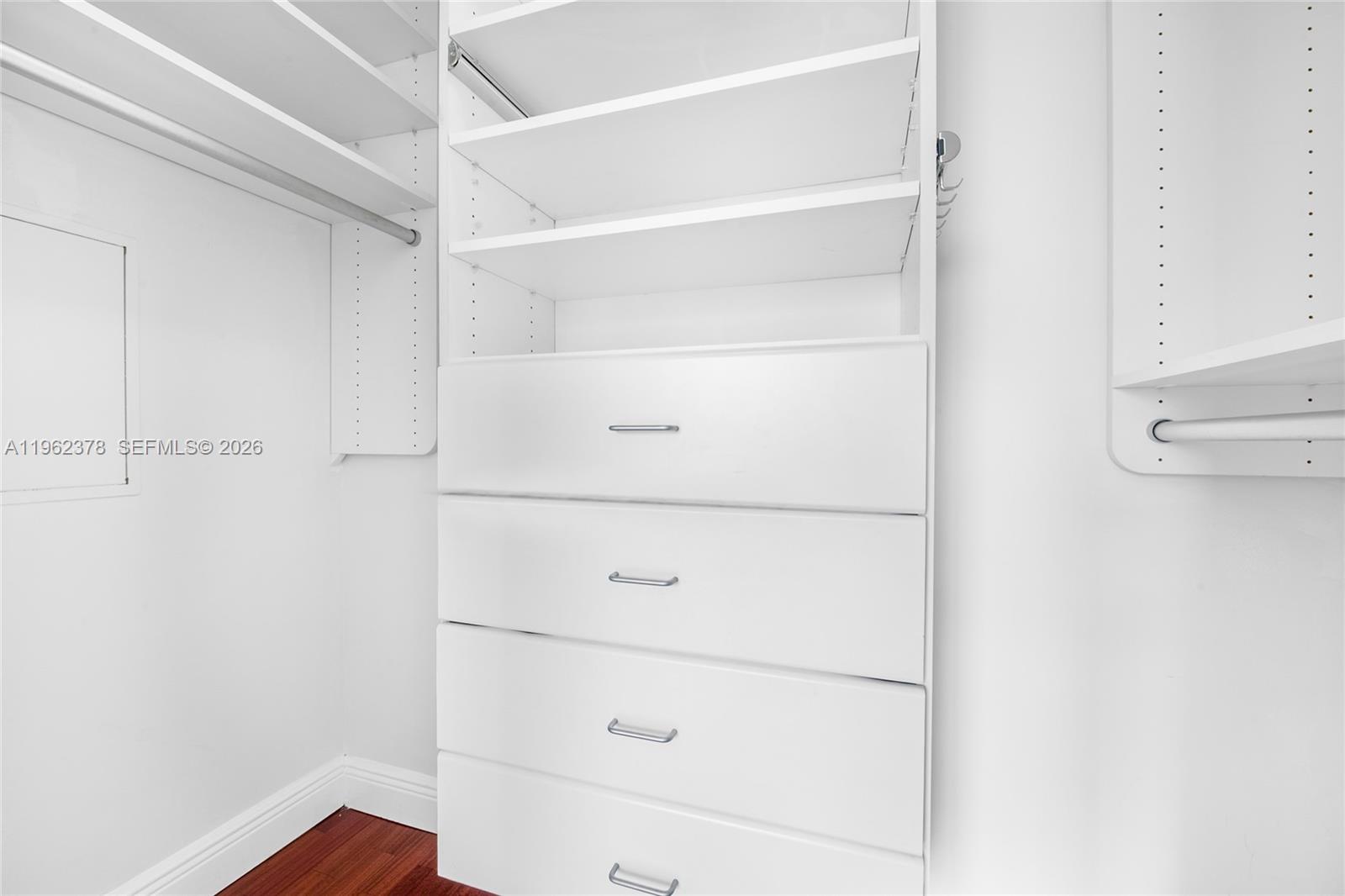 7270 Southwest 88th Street, Unit B303 Miami, FL 33156 - Photo 11 of 15 a view of an empty walk in closet