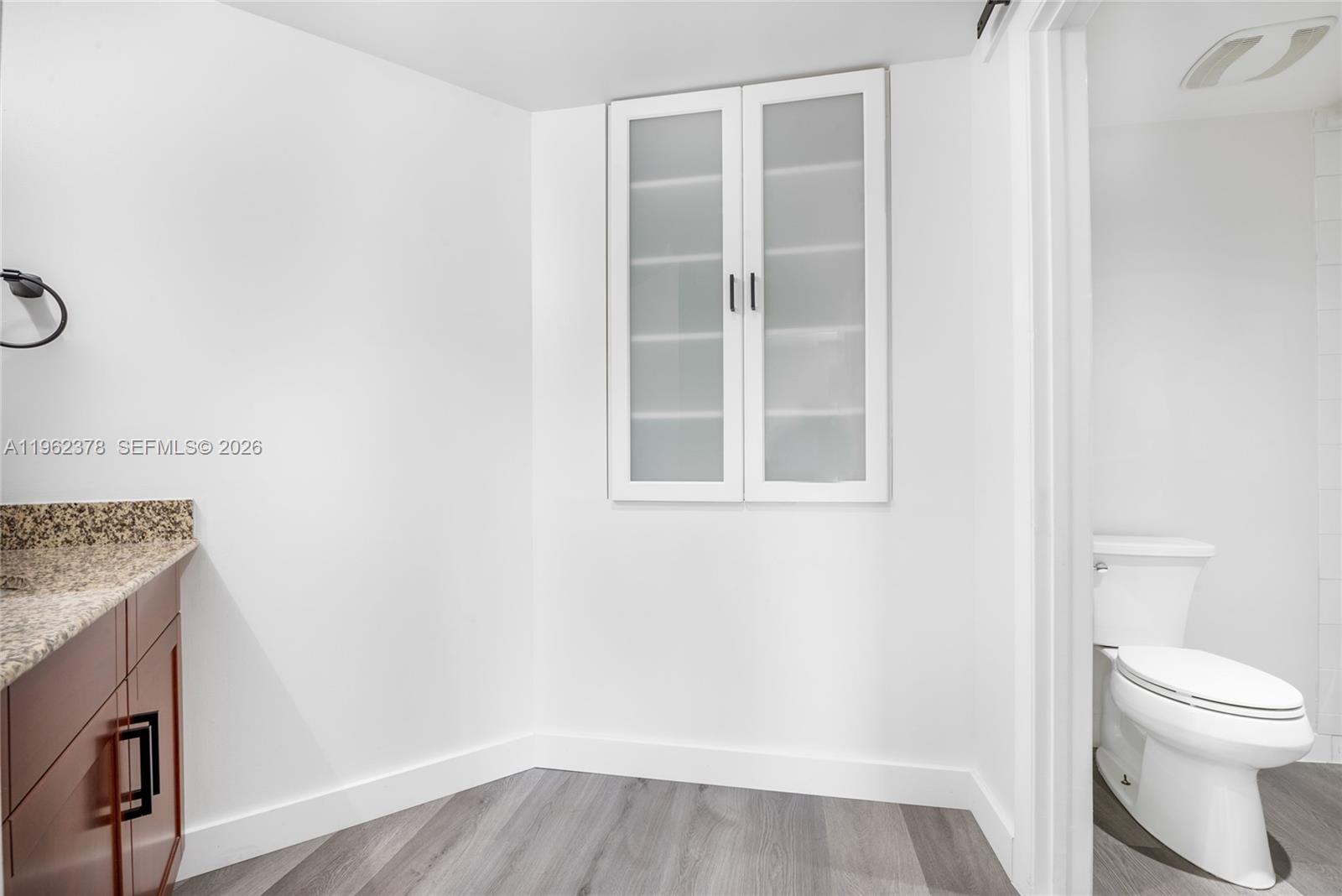 7270 Southwest 88th Street, Unit B303 Miami, FL 33156 - Photo 12 of 15 a bathroom with a toilet and a sink