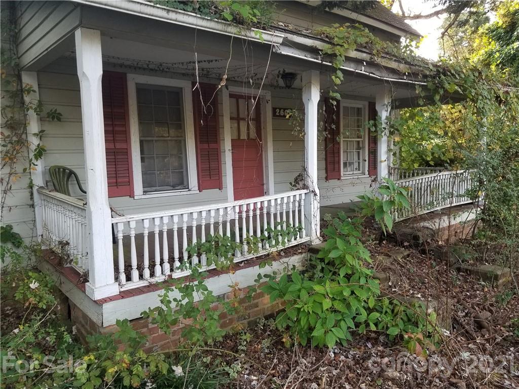 2601 Highway 64 Rutherfordton, NC 28139 - Photo 2 of 3 a view of a house with a small yard and wooden floor and fence