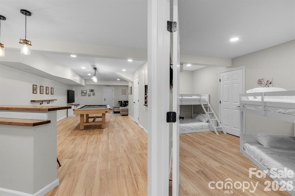 56 Great Horned Owl Road Candler, NC 28715 - Photo 25 of 32 a living room with furniture and a wooden floor