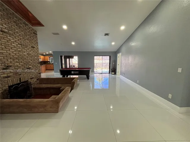 a kitchen with granite countertop a sink and cabinets