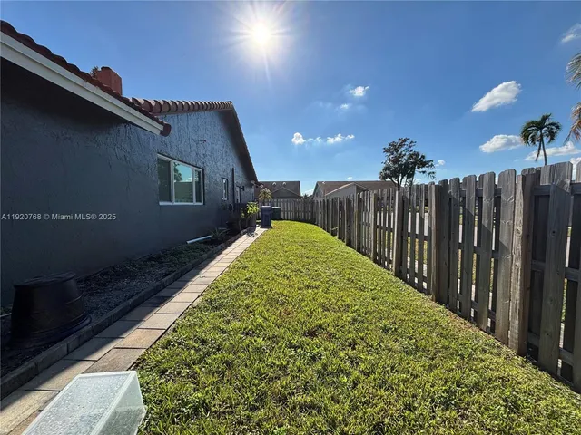 a view of a backyard of the house