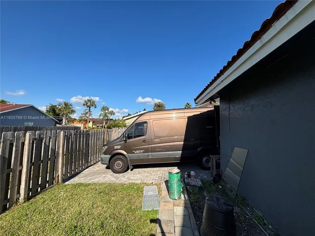 a car parked in front of a house