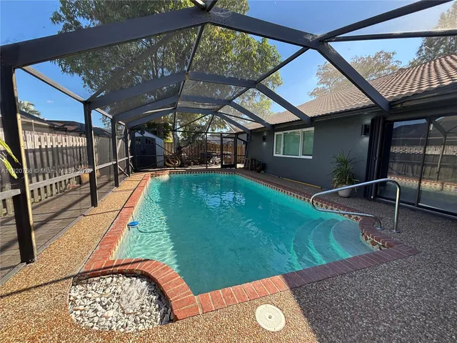 a view of a backyard with a patio