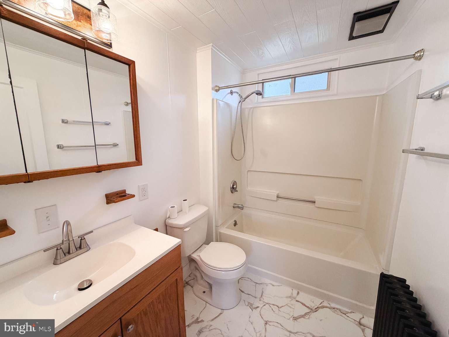 1424 Wayne Street Reading, PA 19601 - Photo 11 of 19 a bathroom with a sink toilet and shower